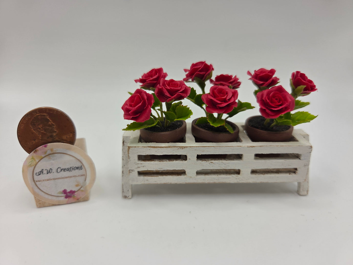 Potted Red Roses in Wooden Stand