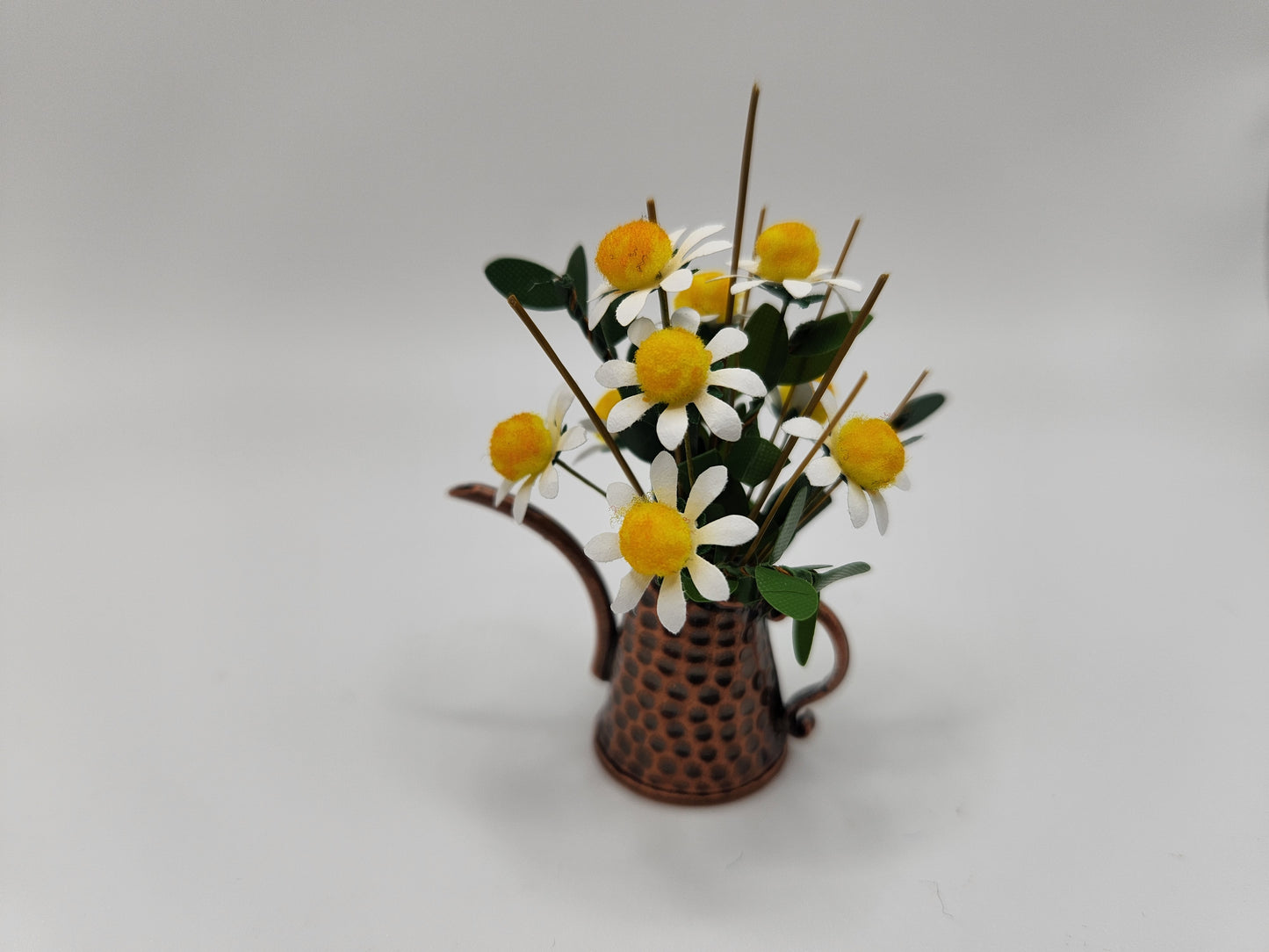 Daisy filled watering can