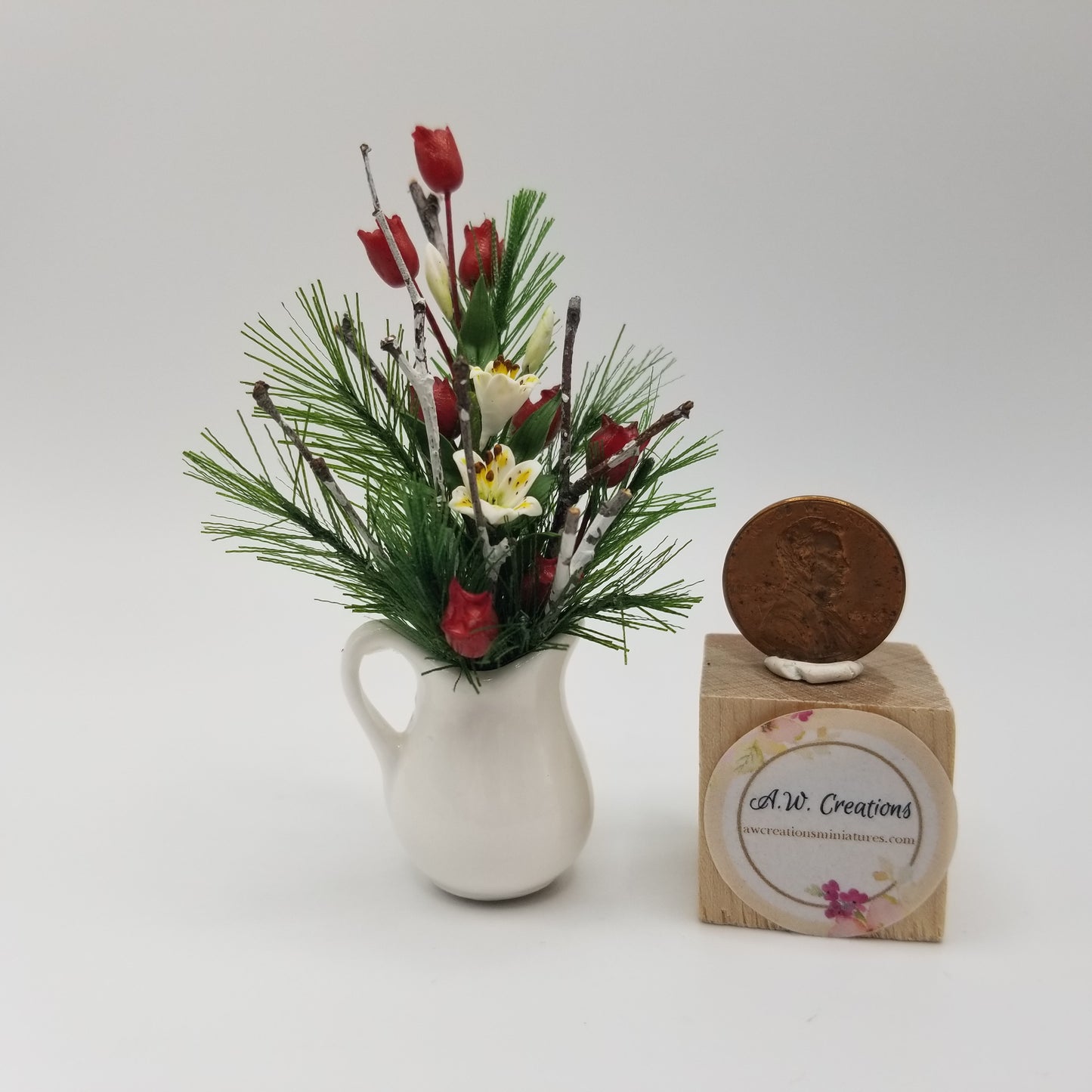 Evergreen Arrangement in White Pitcher