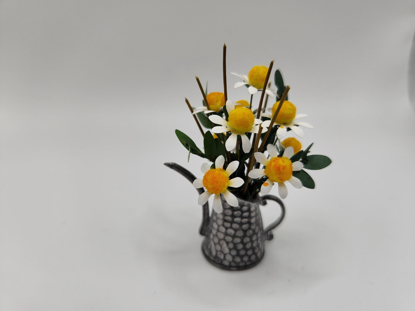Daisy filled watering can