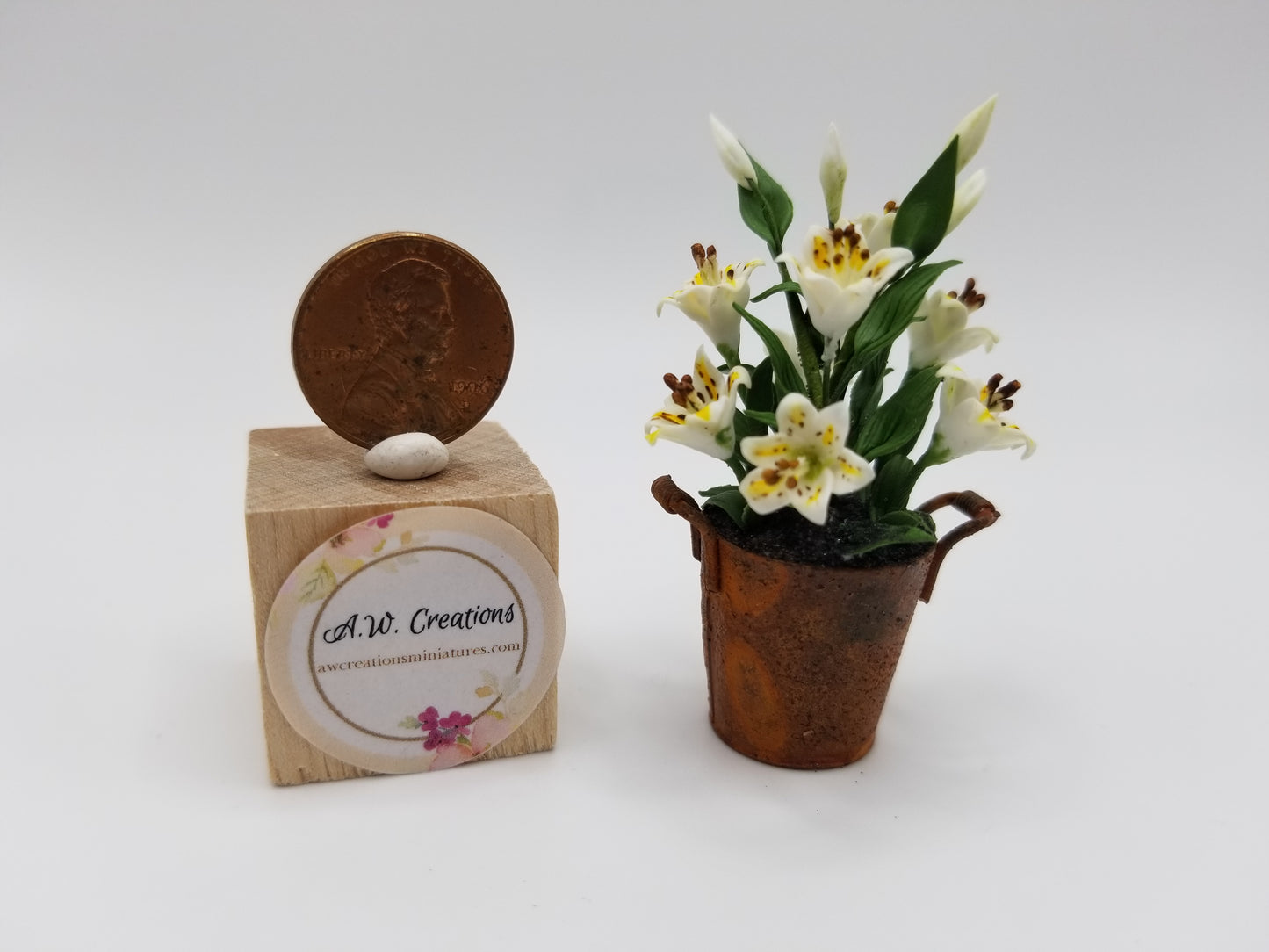 White lilies in rusted bucket
