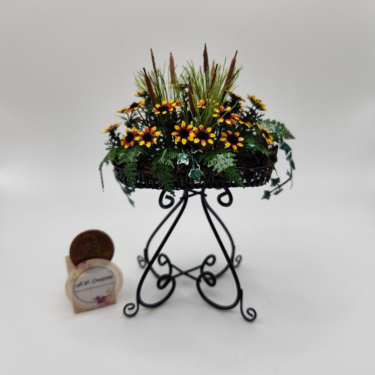 Black Eyed Susan in Black Wire Plant Stand