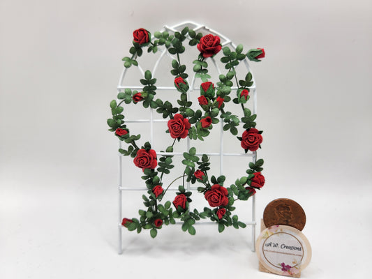 Trellis with climbing red rose