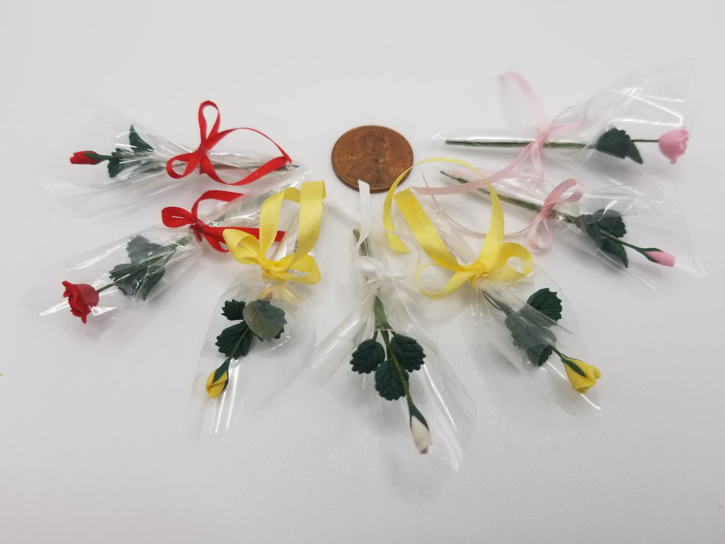 miniature dollhouse single rose bud bouquet wrapped in cellophane with matching bow closed bud or open rose option. one inch scale 1:!2